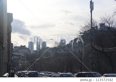 Traffic on a Moscow street, shiny wires, February 2022. 113572582