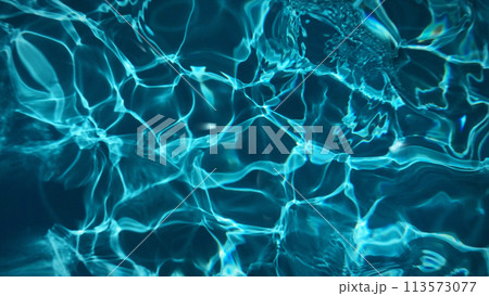 Animated transparent clean blue swimming pool water surface with waves and sunlight glitters. Water background light reflection, pool bottom, moving liquid plastic smooth. 8k wallpaper 4k screensaver. 113573077