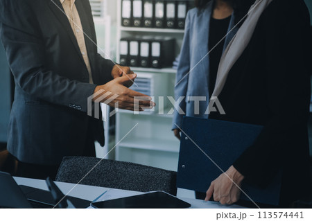 Group of businesspeople meeting in office. Teamwork of business. Group of businesspeople meeting in office. Teamwork of business. 113574441