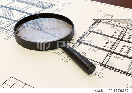 Magnifying glass on a drawing 113576877