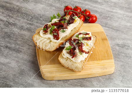 Bruschetta with strachatella and dry tomato Bruschetta with strachatella and dry tomato 113577018