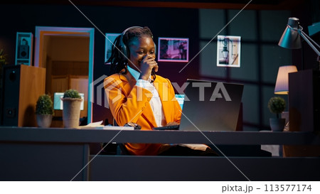 African american girl listening to professor debating latest lesson, taking notes after understanding explanations. Student participating at online school classes on academic platform. Camera B. African american girl listening to professor debating latest lesson, taking notes after understanding explanations. Student participating at online school classes on academic platform. Camera B. 113577174