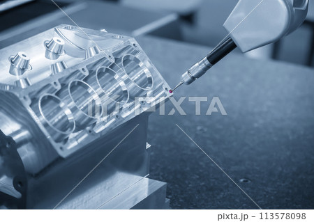 The multi axis CMM machine measuring the V8 aluminum engine cylinder block parts. The multi axis CMM machine measuring the V8 aluminum engine cylinder block parts. 113578098
