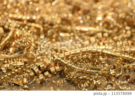 Close-up scene of  the brass materials scrap from turning process. Close-up scene of  the brass materials scrap from turning process. 113578099