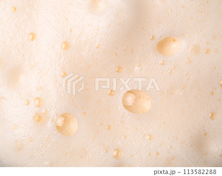 Beer or cappucino foam with bubbles texture 113582288