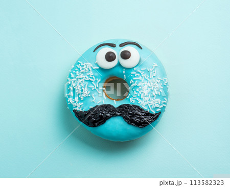 Blue glazed donut with mustache flying 113582323