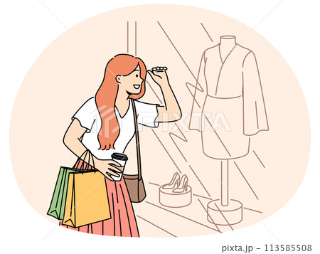Smiling woman shopping looking in showcase 113585508