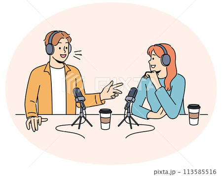 Smiling people talk in microphones on radio live Smiling people talk in microphones on radio live 113585516
