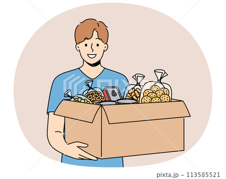 Smiling volunteer with box of food donate at crisis center 113585521