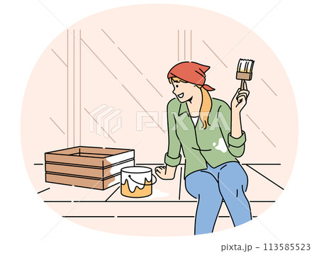 Smiling woman renovate wooden box on terrace 113585523