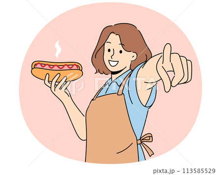 Smiling woman hold hot dog point at screen Smiling woman hold hot dog point at screen 113585529