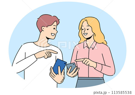 Smiling couple browse internet on cellphones 113585538