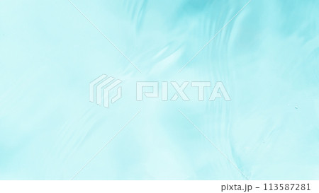 Freeze motion of splashing water surface on light blue background Freeze motion of splashing water surface on light blue background 113587281