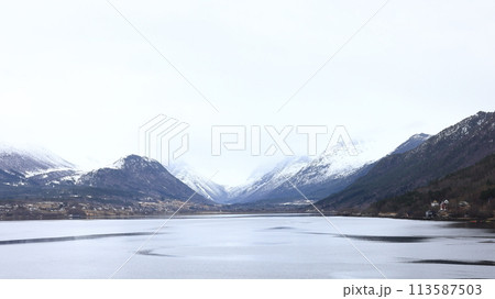 The view from the Andalsnes waterfront looking towards Isfjorden, Norway. Isfjorden is a small village in the Rauma Valley on the shores of Romsdalsfjord. The view from the Andalsnes waterfront looking towards Isfjorden, Norway. Isfjorden is a small village in the Rauma Valley on the shores of Romsdalsfjord. 113587503