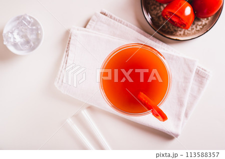 Closeup of trendy tomato martini cocktail in a glass on the table top view 113588357