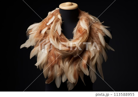 A feather scarf adorns a mannequin in a fashion design event A feather scarf adorns a mannequin in a fashion design event 113588955