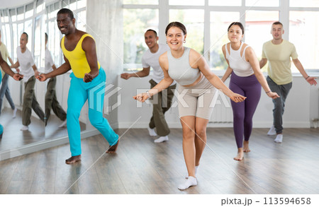 Young woman practicing hip-hop dance in training hall Young woman practicing hip-hop dance in training hall 113594658