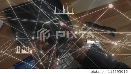 African American businessman analyzes data on a laptop, with copy space 113595016
