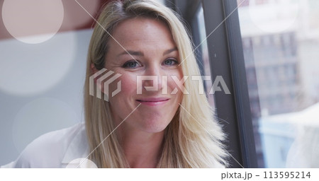 Image of spotlights over caucasian businesswoman in office Image of spotlights over caucasian businesswoman in office 113595214