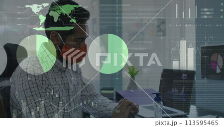Statistical data processing against man wearing face mask sanitizing his hands at office 113595465