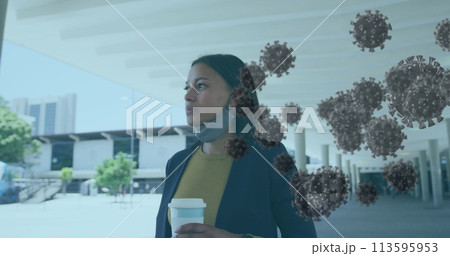 Image of covid 19 cells over woman holding a coffee with face mask 113595953