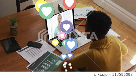 Image of digital social media heart icons over woman using laptop on image call 113596098