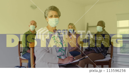 Image of social distancing text over senior people wearing face masks Image of social distancing text over senior people wearing face masks 113596256