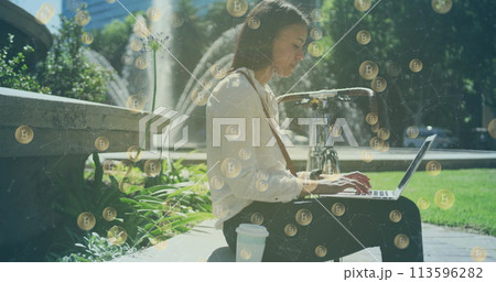 Image of bitcoin icons over woman using laptop in park Image of bitcoin icons over woman using laptop in park 113596282