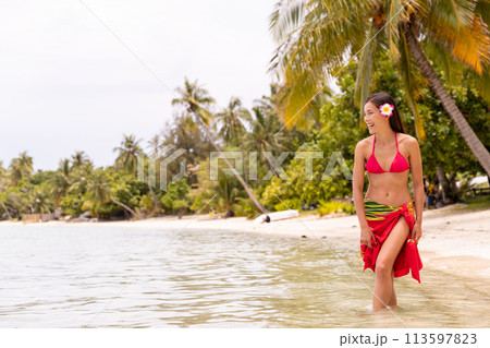 French Polynesia video of woman wearing traditional pareo and Bikini relaxing on perfect beach on Bora Bora. French Polynesia Beach Vacation Travel French Polynesia video of woman wearing traditional pareo and Bikini relaxing on perfect beach on Bora Bora. French Polynesia Beach Vacation Travel 113597823