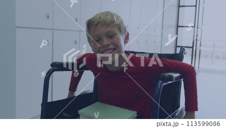 Image of letters over happy caucasian schoolboy in wheelchair 113599086