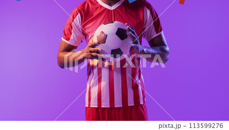 African American man holds a soccer ball, with copy space 113599276