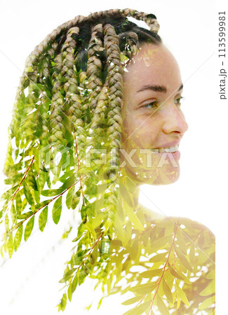 A double exposure portrait of a woman merged with a photo of green tree leaves. A double exposure portrait of a woman merged with a photo of green tree leaves. 113599981