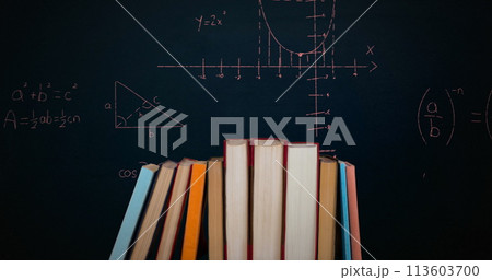 Digital image of a pile of books while mathematical equations and graphs move in the screen against Digital image of a pile of books while mathematical equations and graphs move in the screen against 113603700