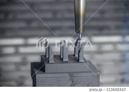 The CNC milling machine cutting the graphite electrode parts. The CNC milling machine cutting the graphite electrode parts. 113608387