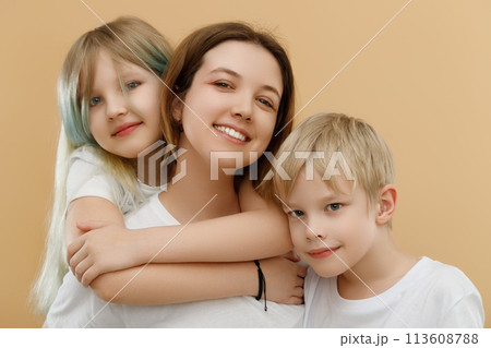Happy people. Mother's Day. Mother hugging her Happy people. Mother's Day. Mother hugging her 113608788