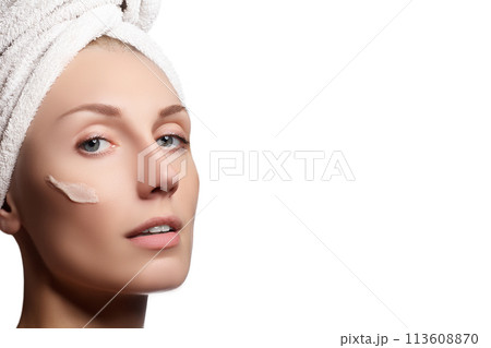 Skin Care Woman Applying Cream on Cheek. Closeup Skin Care Woman Applying Cream on Cheek. Closeup 113608870