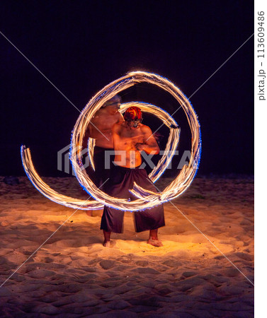 Fire show in Khao Lak beach in Phang Nga, Thailand 113609486