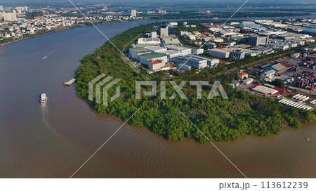 Aerial view from drone of Ho Chi Minh city port, canal system for traffic waterway on Saigon river, crane and container at riverside harbor, logistic for export, import industrial with cheap expense 113612239