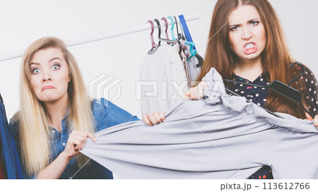 Women arguing during clothes shopping 113612766