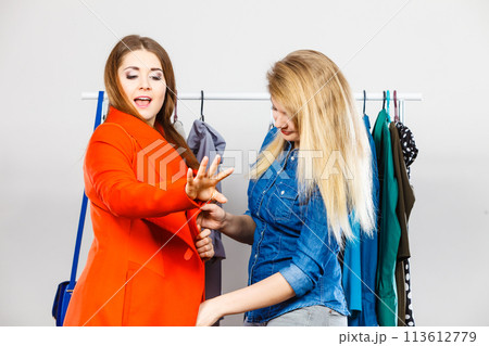 Two women on clothes shopping Two women on clothes shopping 113612779