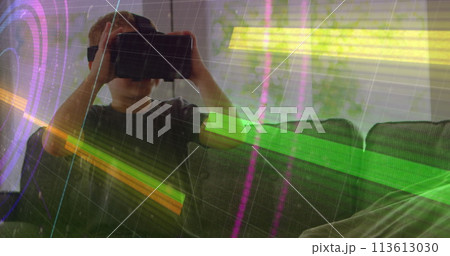 Light trails over scope scanning against caucasian boy wearing vr headset at home Light trails over scope scanning against caucasian boy wearing vr headset at home 113613030
