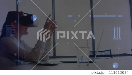 Digital interface with data processing against caucasian woman wearing vr headset at office Digital interface with data processing against caucasian woman wearing vr headset at office 113613084