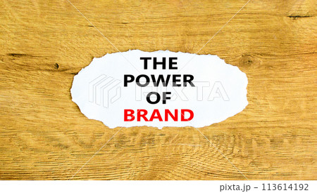 The power of brand symbol. Concept words The power of brand on beautiful white paper. Beautiful wooden background. Business the power of brand concept. Copy space. The power of brand symbol. Concept words The power of brand on beautiful white paper. Beautiful wooden background. Business the power of brand concept. Copy space. 113614192