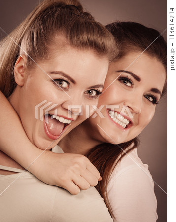 Two happy women friends having fun Two happy women friends having fun 113614214