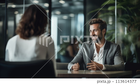 Business executives casually converse in a relaxed office ambiance 113614377