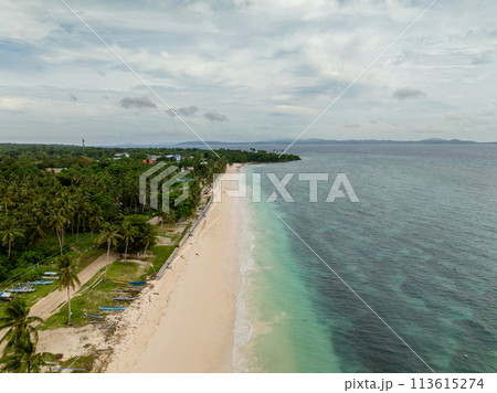 Poblacion San Jose and white sandy beach with ocean waves in Carabao Island. Romblon. Philippines. 113615274