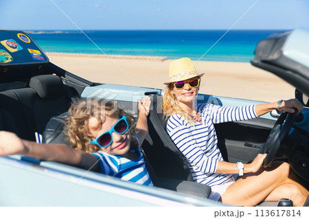 Happy family travels by car on summer vacation 113617814