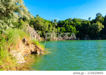 View of the lake at abandoned quarry on summer 113620605