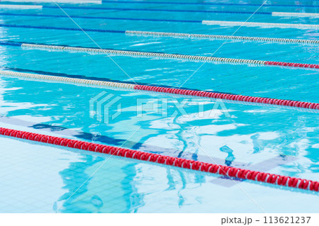 competition pool with blue water and marked swimming lanes 113621237