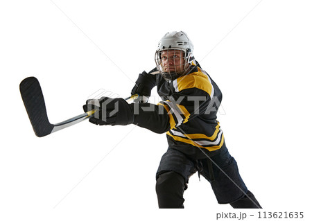 Competitive, concentrated man, hockey player with stick in motion during game, training isolated on white background Competitive, concentrated man, hockey player with stick in motion during game, training isolated on white background 113621635